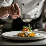 A chef preparing a delicious dish in a fine restaurant. Chef Dressing the dish